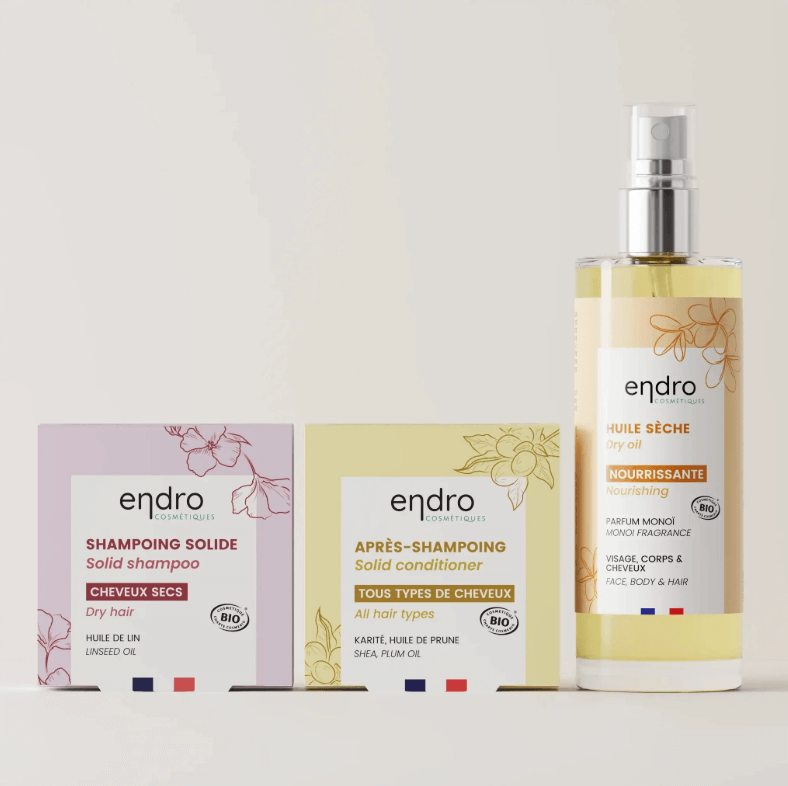 Natural hair care products for dry hair, including solid shampoo, conditioner, and nourishing dry oil, sulfate-free clean beauty.