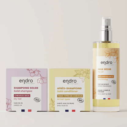 Natural hair care products for dry hair, including solid shampoo, conditioner, and nourishing dry oil, sulfate-free clean beauty.