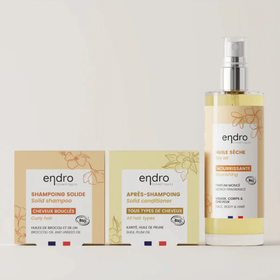 Curly hair care routine: French clean beauty solid shampoo, conditioner, and nourishing dry oil for natural hydration.