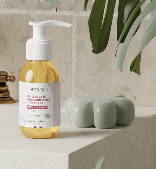 Double cleansing oil with natural ingredients in a clean beauty setting for a radiant face cleaning routine.