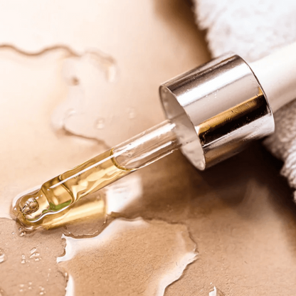 Close-up of a dropper with anti-blemish serum on a clean surface. Ideal for natural skincare and purifying care.