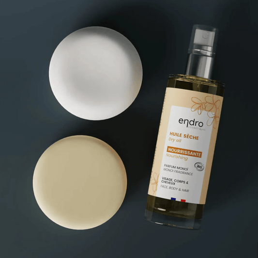 Natural shampoo bars and nourishing dry oil for balanced daily hair care in a clean beauty routine.