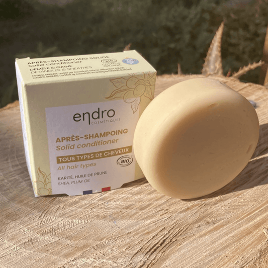 Natural solid conditioner for all hair types, promoting zero waste and clean beauty in sustainable packaging.